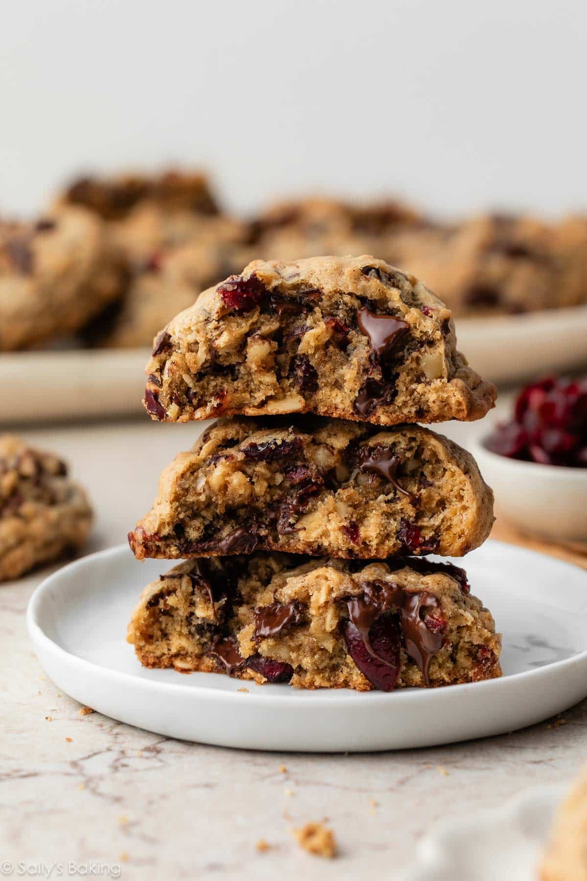 stack of 3 thick dark chocolate cranberry oatmeal cookies.
