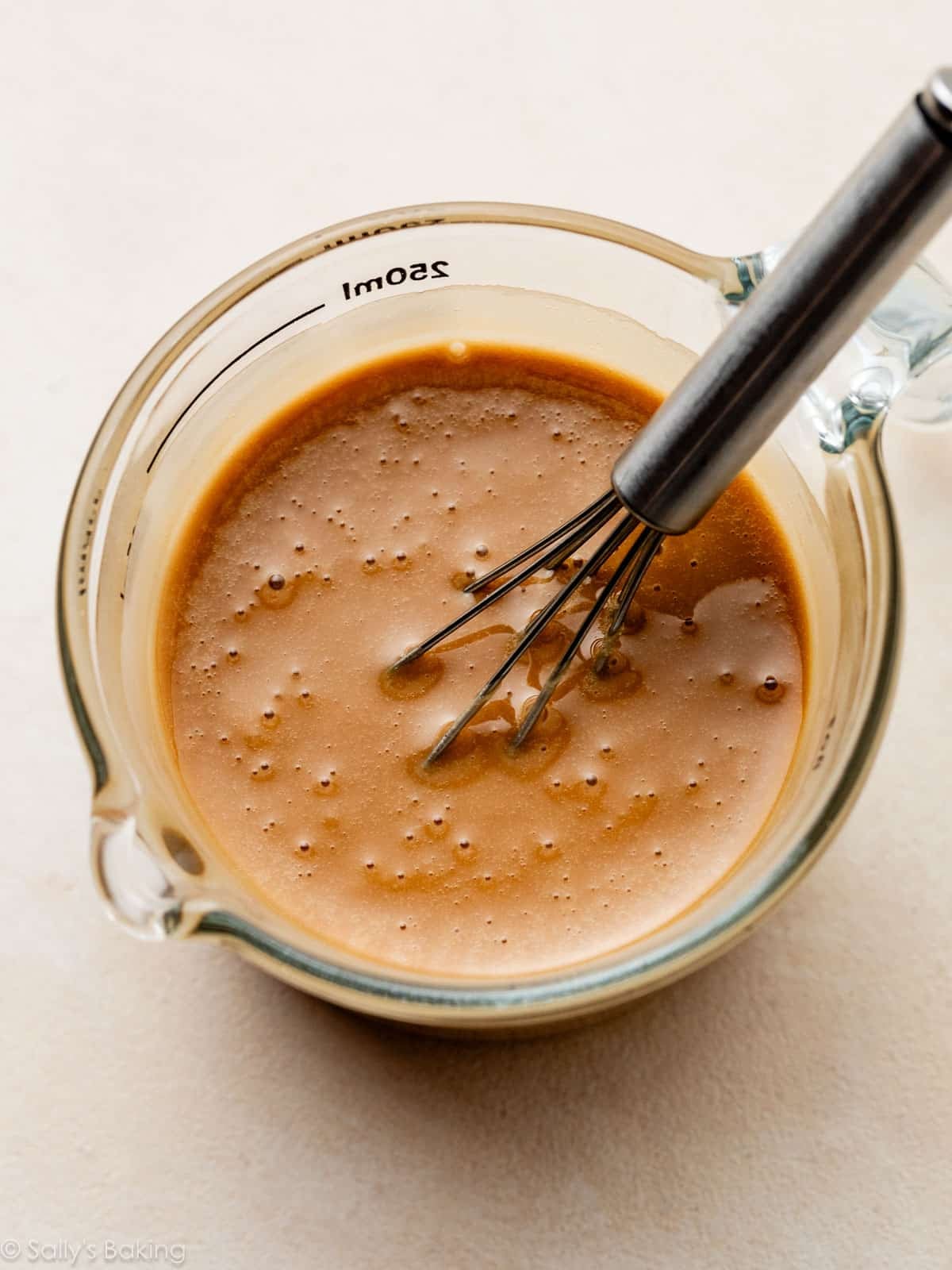 espresso icing in liquid measuring cup.