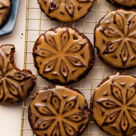 chocolate stamped cookies with icing.