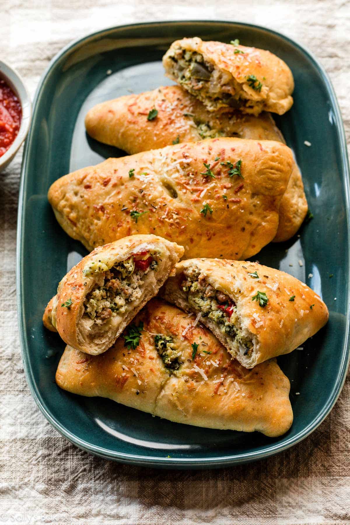 calzones on teal plate.