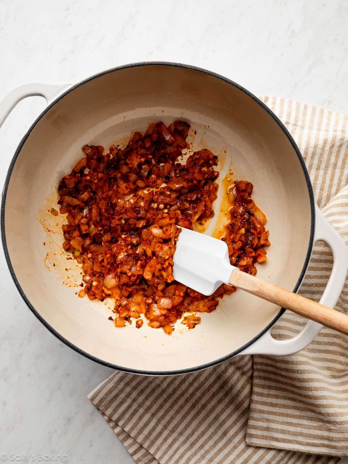 sautรฉed onions, garlic, and herbs in pot.
