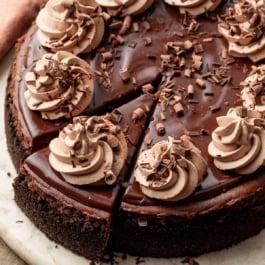 chocolate cheesecake on a serving platter.