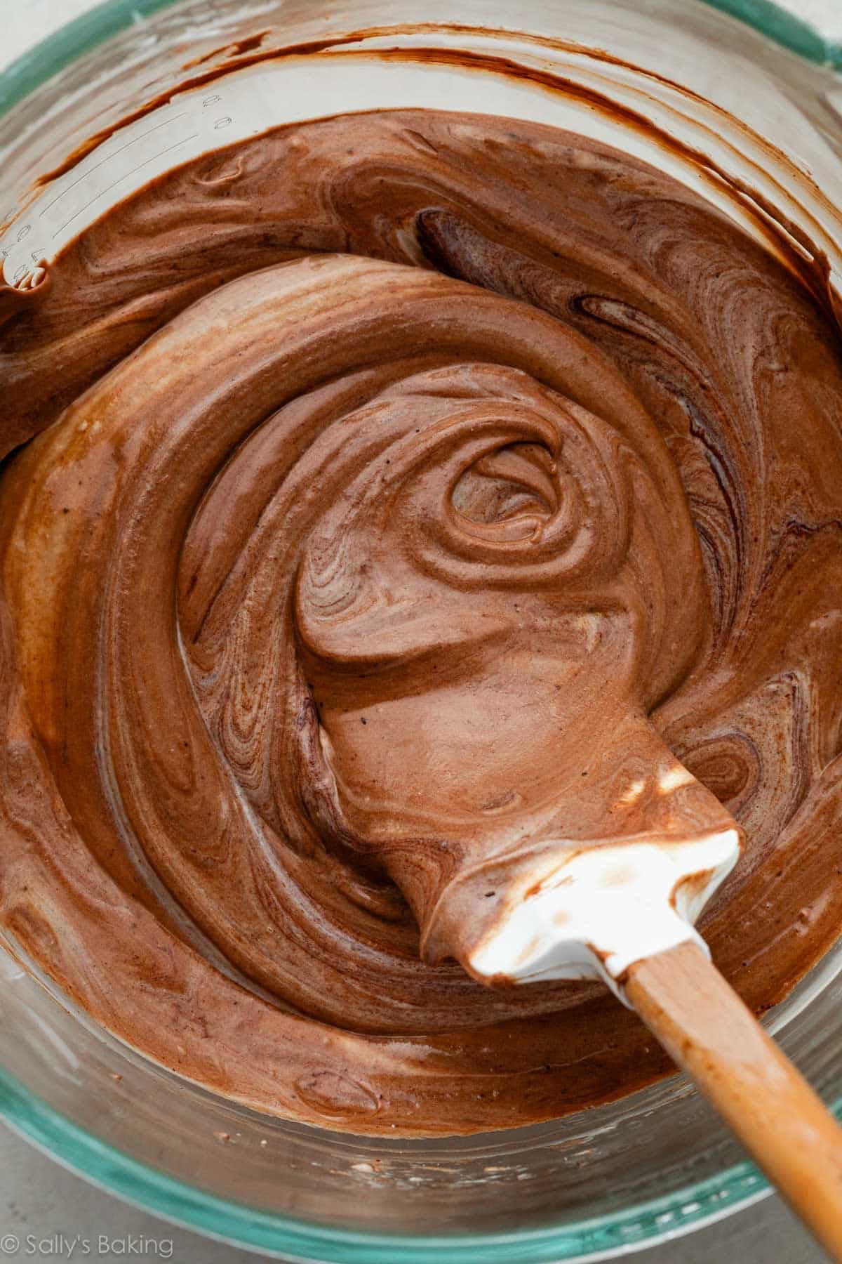 spatula stirring chocolate batter.